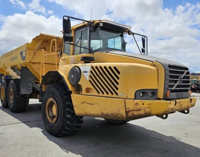 Dump truck for sale in Syria, Volvo A35D 1990 model, located in Aleppo, the best site for selling trucks and heavy equipment in Syria.