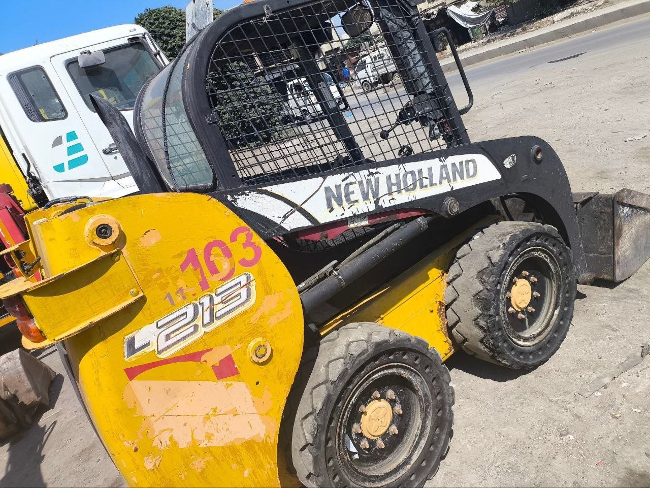 Bobcats in Syria, New Holland 103 model 2015 located in Idlib, the best site for selling trucks and heavy equipment in Syria.