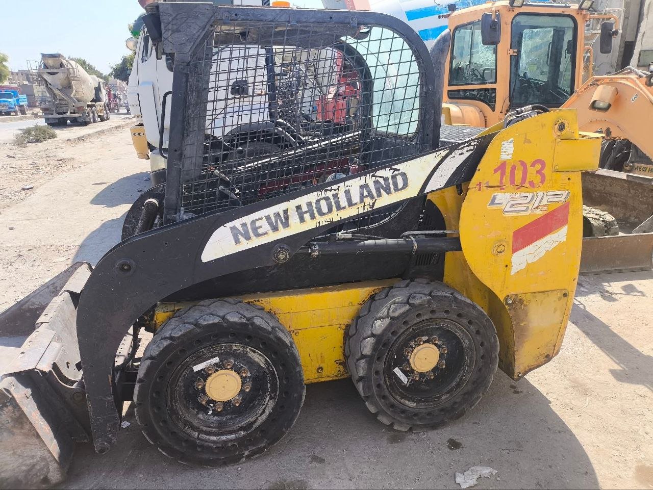 Bobcats in Syria, New Holland 103 model 2015 located in Idlib, the best site for selling trucks and heavy equipment in Syria.